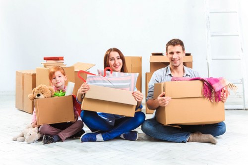 Professional office movers handling furniture