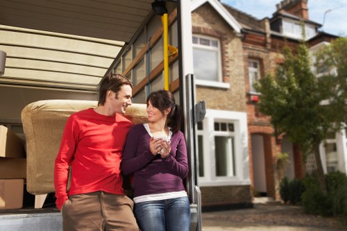 Experienced movers packing delicate items with care